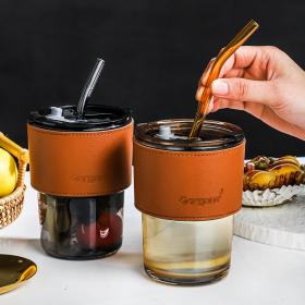 Glass cup with straw
